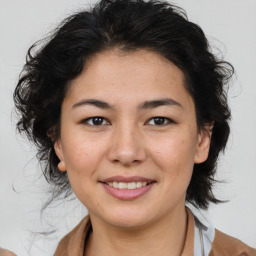 Joyful asian young-adult female with medium  brown hair and brown eyes