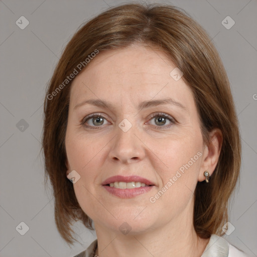 Joyful white adult female with medium  brown hair and grey eyes