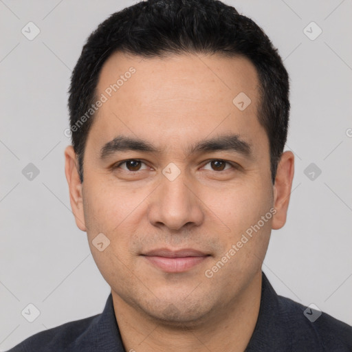 Joyful white young-adult male with short  black hair and brown eyes