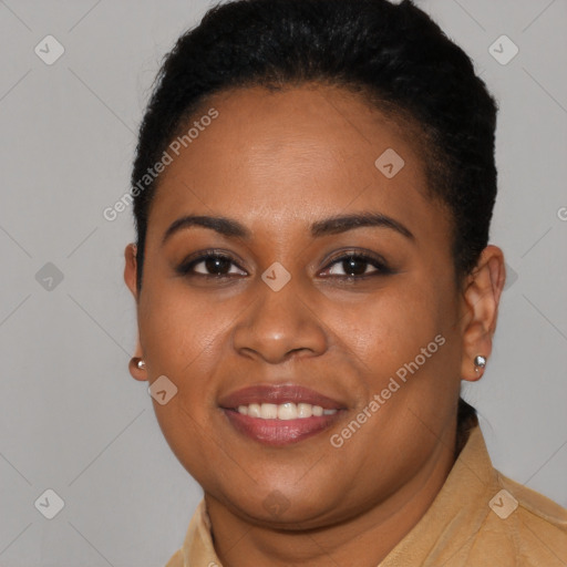 Joyful black young-adult female with short  black hair and brown eyes
