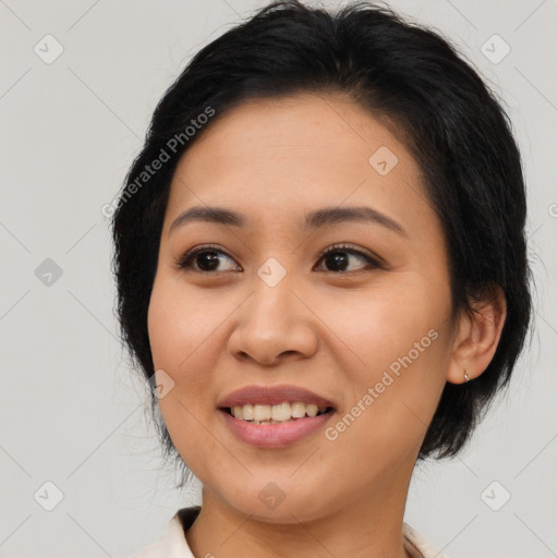 Joyful latino young-adult female with medium  brown hair and brown eyes