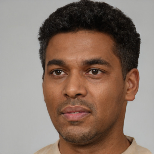 Neutral black young-adult male with short  black hair and brown eyes