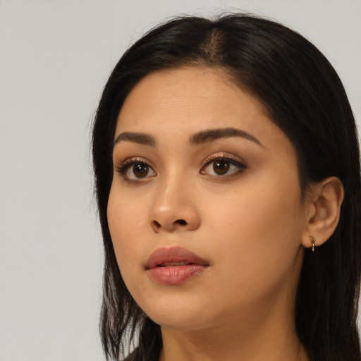 Neutral latino young-adult female with long  black hair and brown eyes