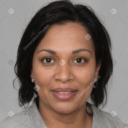 Joyful black adult female with medium  brown hair and brown eyes