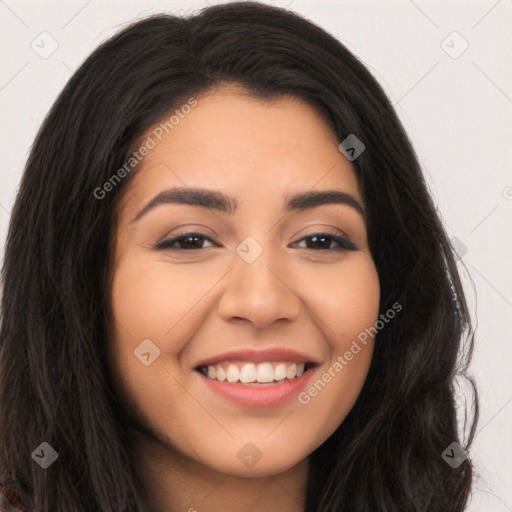 Joyful latino young-adult female with long  brown hair and brown eyes