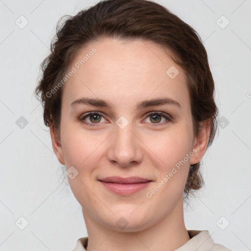 Joyful white young-adult female with medium  brown hair and grey eyes