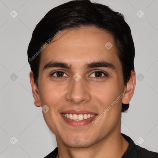 Joyful white young-adult male with short  black hair and brown eyes