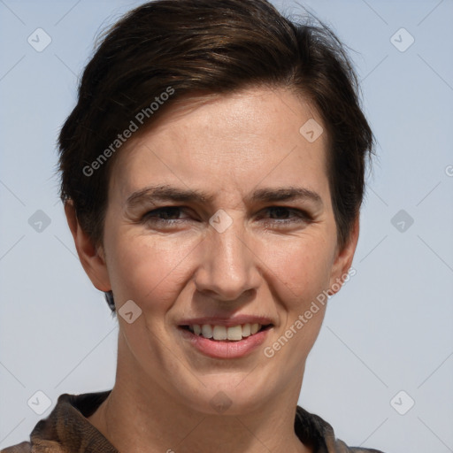 Joyful white adult female with short  brown hair and grey eyes