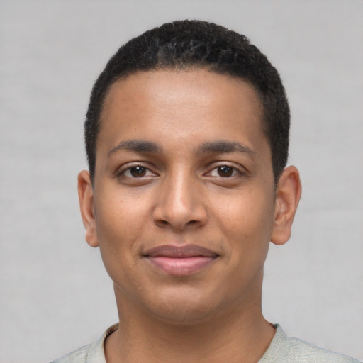Joyful latino young-adult male with short  black hair and brown eyes