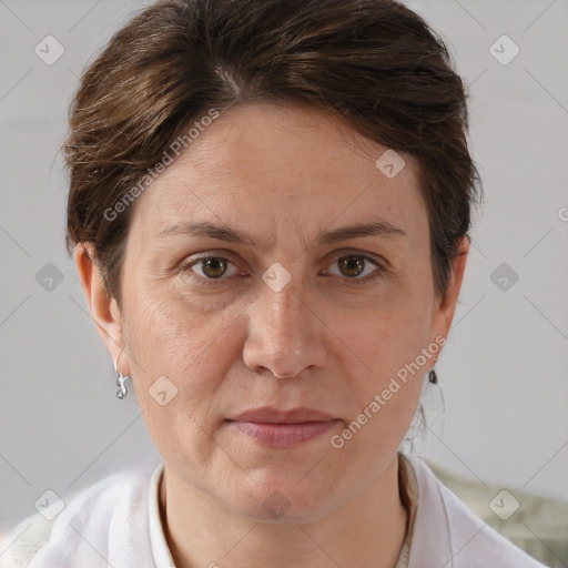 Joyful white adult female with short  brown hair and brown eyes