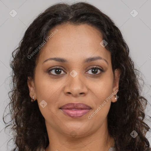 Joyful black adult female with medium  brown hair and brown eyes