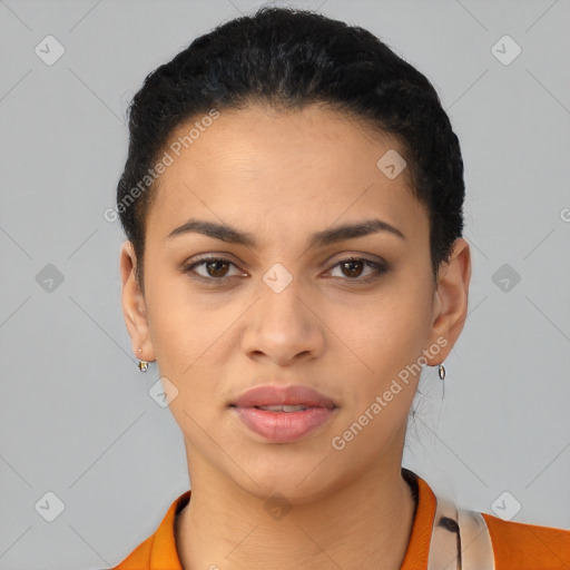 Joyful latino young-adult female with short  black hair and brown eyes