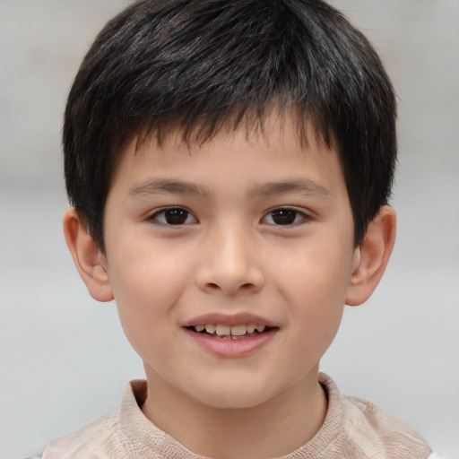 Joyful white child male with short  brown hair and brown eyes