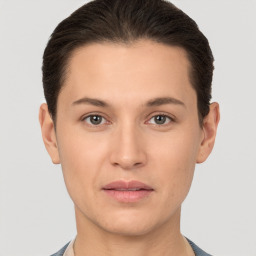 Neutral white young-adult female with short  brown hair and brown eyes
