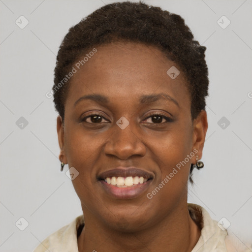 Joyful black young-adult female with short  brown hair and brown eyes