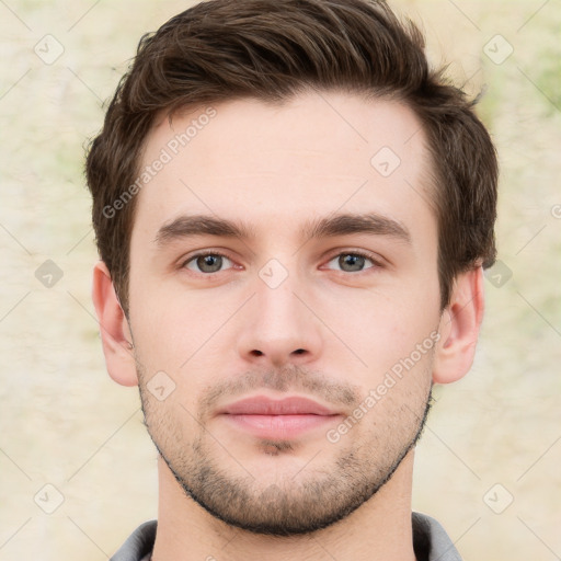 Neutral white young-adult male with short  brown hair and grey eyes