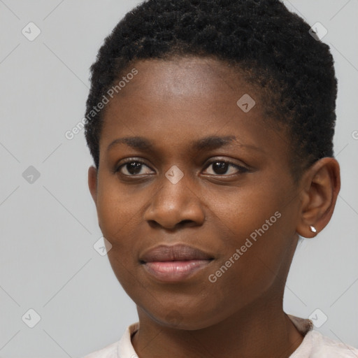 Joyful black young-adult female with short  black hair and brown eyes