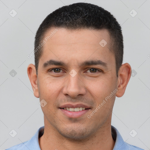 Joyful white young-adult male with short  black hair and brown eyes