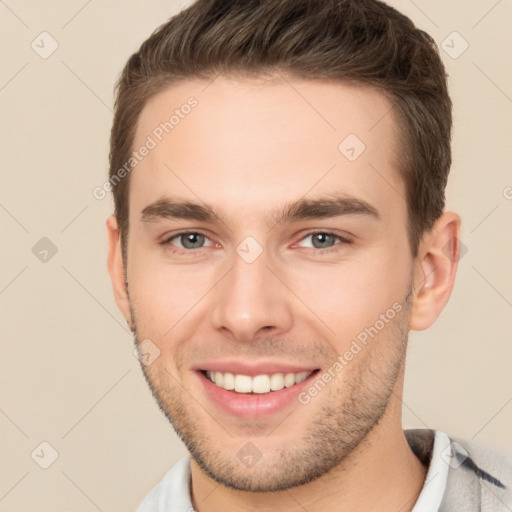 Joyful white young-adult male with short  brown hair and brown eyes