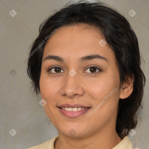 Joyful latino young-adult female with medium  brown hair and brown eyes