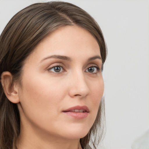 Neutral white young-adult female with medium  brown hair and grey eyes