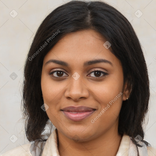 Joyful black young-adult female with medium  brown hair and brown eyes