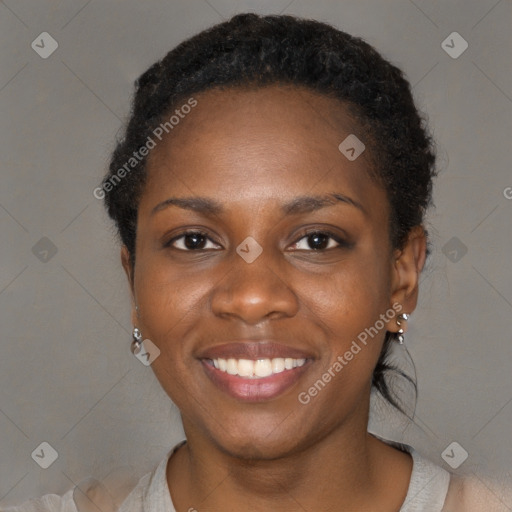 Joyful black young-adult female with short  black hair and brown eyes