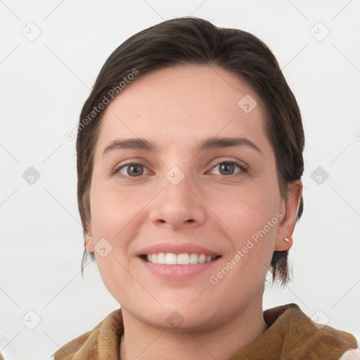 Joyful white young-adult female with medium  brown hair and grey eyes