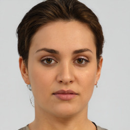 Neutral white young-adult female with short  brown hair and brown eyes