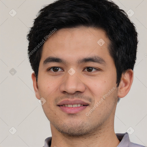 Joyful white young-adult male with short  black hair and brown eyes