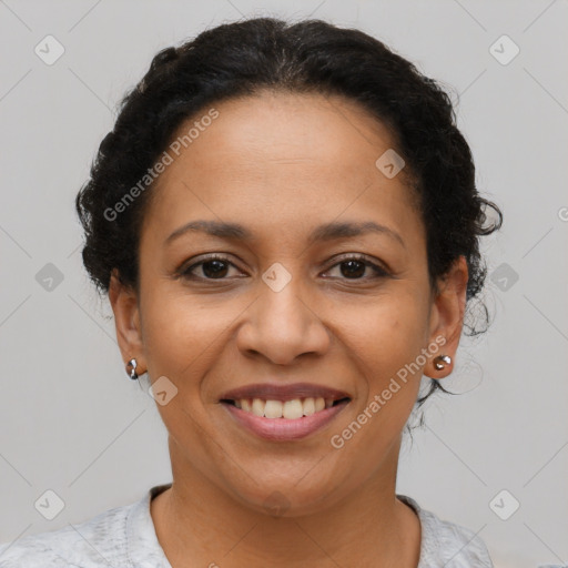 Joyful latino young-adult female with short  brown hair and brown eyes