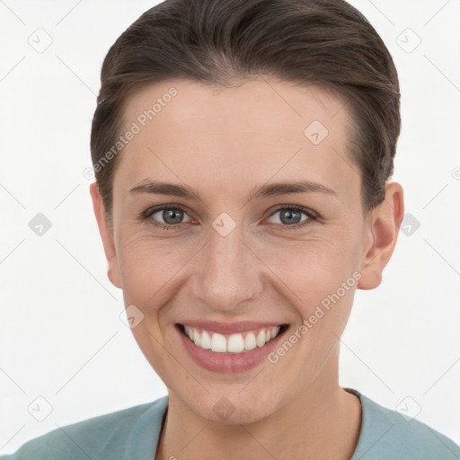 Joyful white young-adult female with short  brown hair and grey eyes