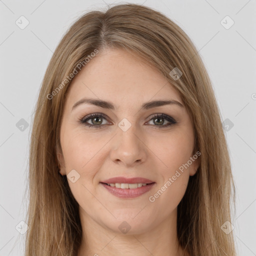 Joyful white young-adult female with long  brown hair and brown eyes