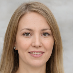 Joyful white young-adult female with long  brown hair and green eyes