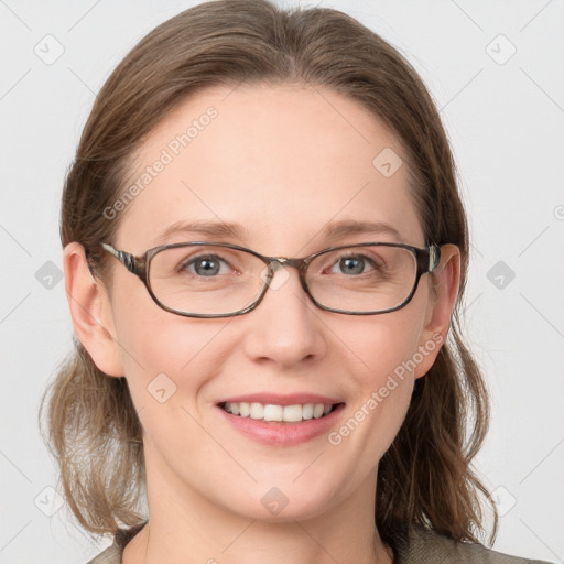 Joyful white young-adult female with medium  brown hair and blue eyes