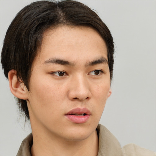 Neutral asian young-adult male with short  brown hair and brown eyes