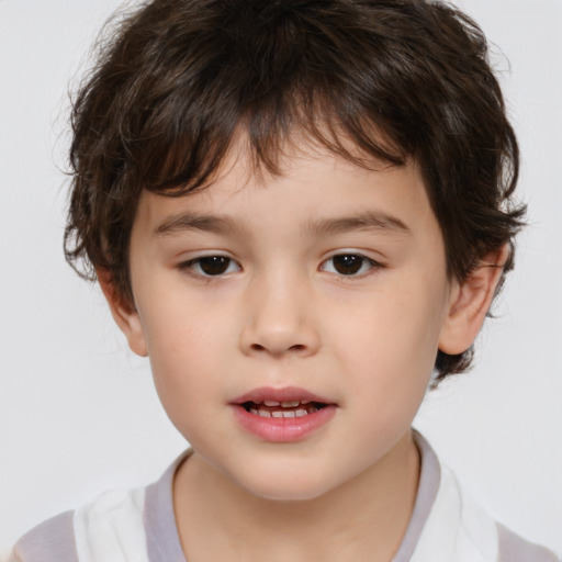 Joyful white child male with medium  brown hair and brown eyes