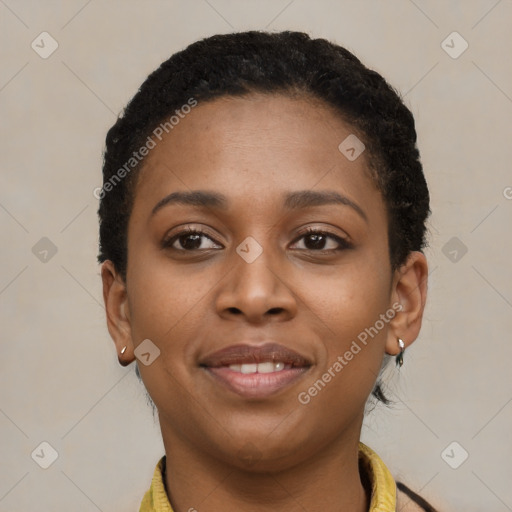 Joyful black young-adult female with short  brown hair and brown eyes