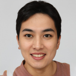 Joyful asian young-adult female with short  black hair and brown eyes