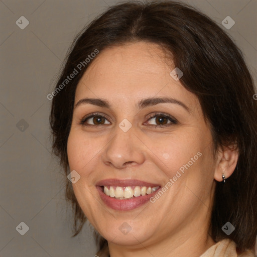 Joyful white adult female with medium  brown hair and brown eyes