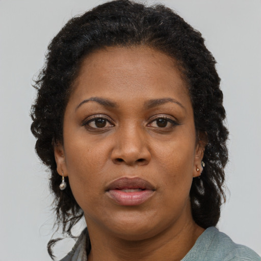 Neutral black adult female with short  brown hair and brown eyes