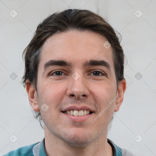 Joyful white adult male with short  brown hair and brown eyes