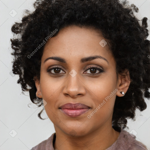 Joyful black young-adult female with medium  black hair and brown eyes