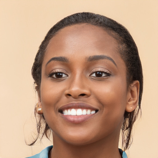 Joyful black young-adult female with medium  brown hair and brown eyes