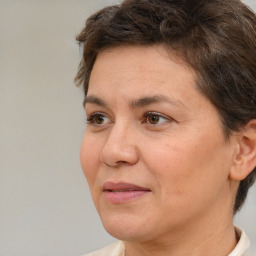 Joyful white adult female with short  brown hair and brown eyes