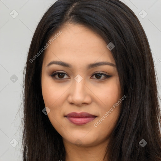 Joyful latino young-adult female with long  brown hair and brown eyes