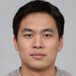 Neutral asian young-adult male with short  brown hair and brown eyes