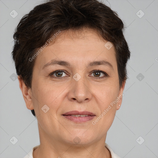 Joyful white adult female with short  brown hair and brown eyes