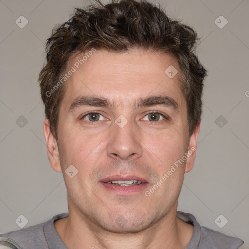 Joyful white adult male with short  brown hair and grey eyes