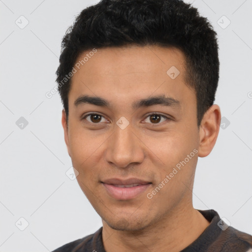 Joyful latino young-adult male with short  black hair and brown eyes